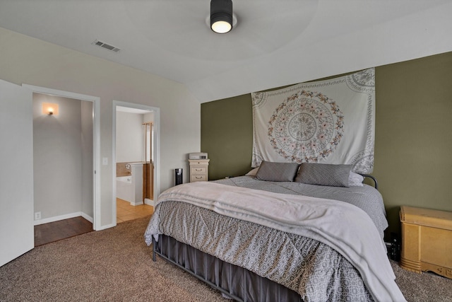 carpeted bedroom with connected bathroom and ceiling fan