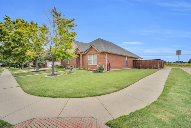 view of side of home with a lawn