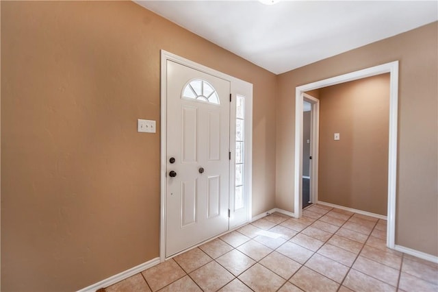 foyer with light tile patterned flooring