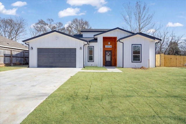 modern farmhouse with a front yard and a garage