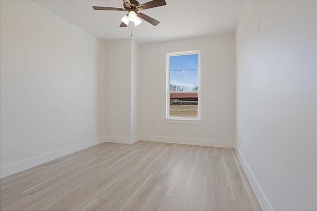 spare room featuring ceiling fan and light hardwood / wood-style floors