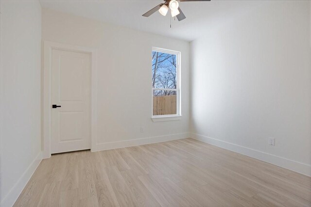 unfurnished room with ceiling fan and light wood-type flooring