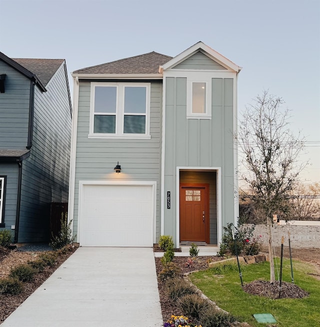 view of front of property with a garage