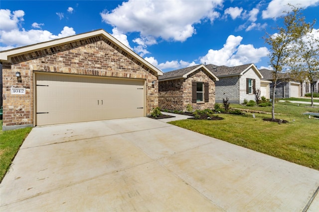 view of front of home featuring a garage and a front yard