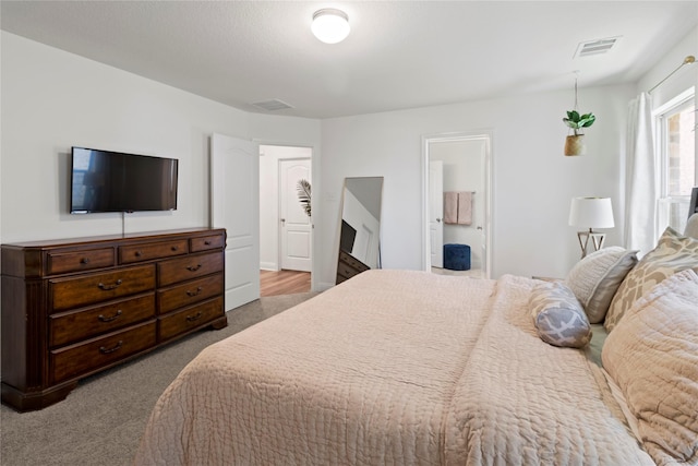 bedroom with light colored carpet