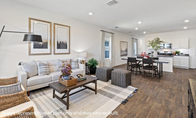 living room with dark hardwood / wood-style flooring