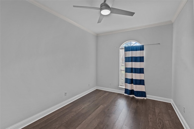 empty room with ceiling fan, dark hardwood / wood-style flooring, and crown molding