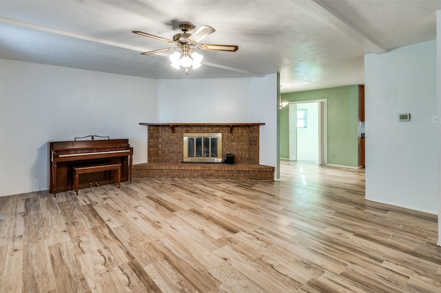 4241 Longmeadow Way, Fort Worth, TX 76133 - unfurnished living room with wood finished floors, ceiling fan, and a fireplace