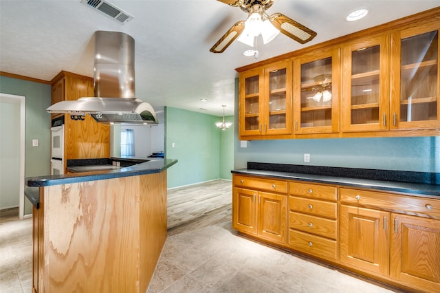 4241 Longmeadow Way, Fort Worth, TX 76133 - kitchen with island range hood, brown cabinets, dark countertops, recessed lighting, and crown molding