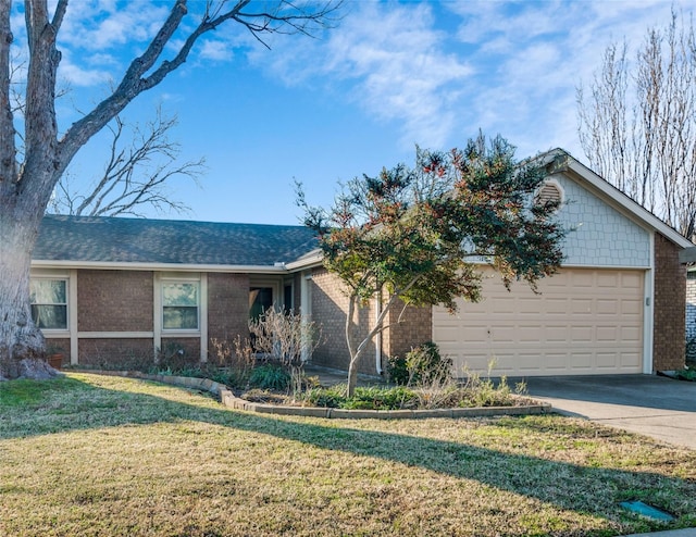 view of front of house with a garage and a front yard