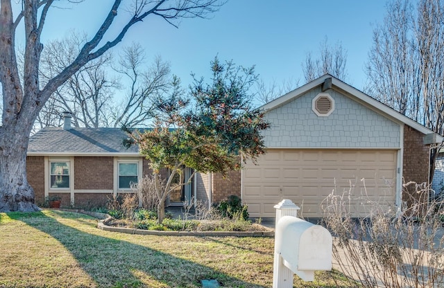 ranch-style house with a front lawn, brick siding, and a garage