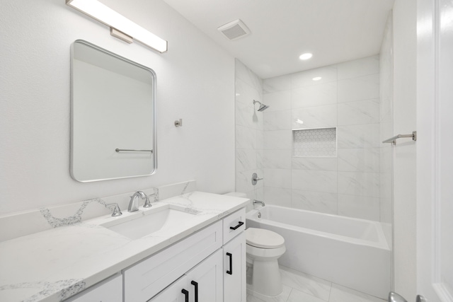 full bathroom featuring toilet, tiled shower / bath combo, and vanity