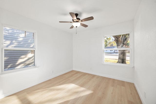 spare room featuring ceiling fan and light hardwood / wood-style floors