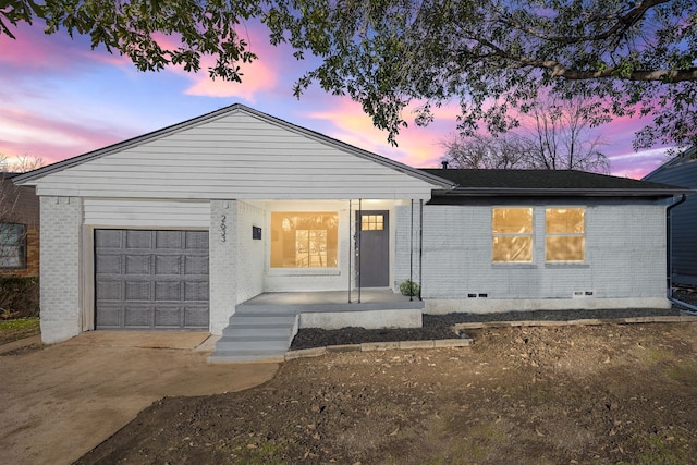 view of front of home featuring a garage and covered porch