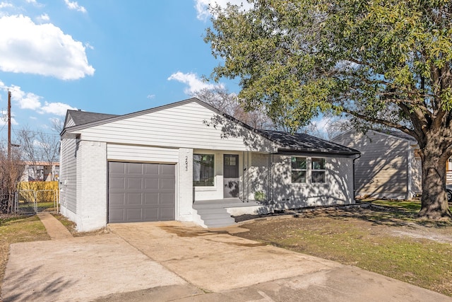 ranch-style house featuring a garage