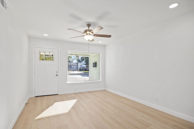 empty room featuring ceiling fan and light wood-type flooring