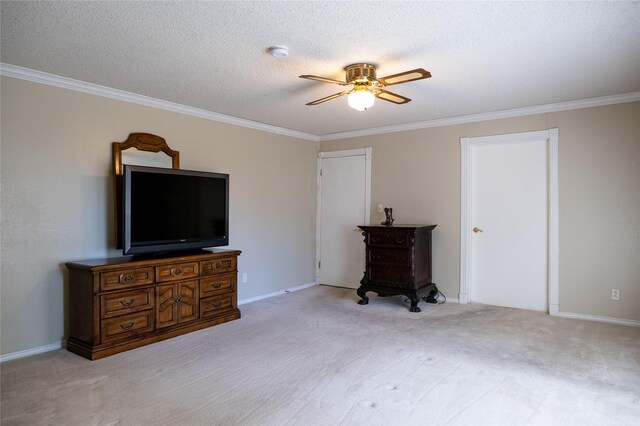 carpeted bedroom with ceiling fan, ornamental molding, and a textured ceiling