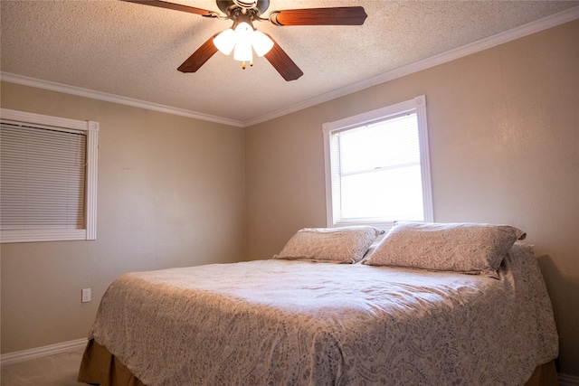 carpeted bedroom featuring ceiling fan, a textured ceiling, and crown molding