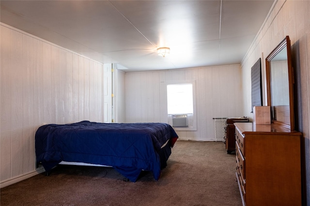 bedroom with cooling unit and dark colored carpet