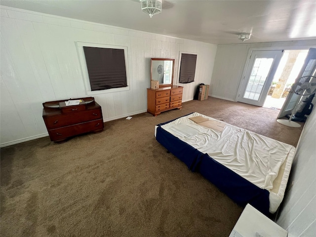 bedroom with carpet and access to exterior