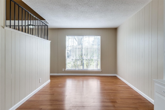 spare room featuring light hardwood / wood-style floors