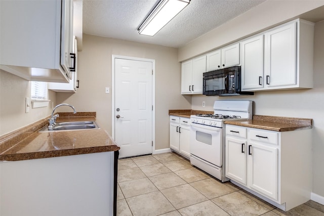 kitchen with sink, white cabinetry, white range with gas cooktop, and a textured ceiling