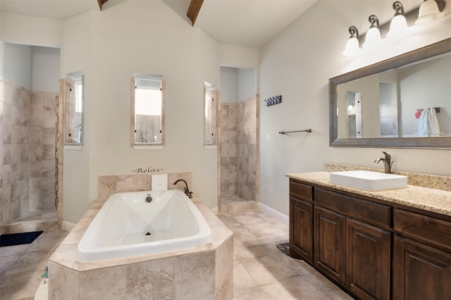 bathroom featuring vanity and shower with separate bathtub