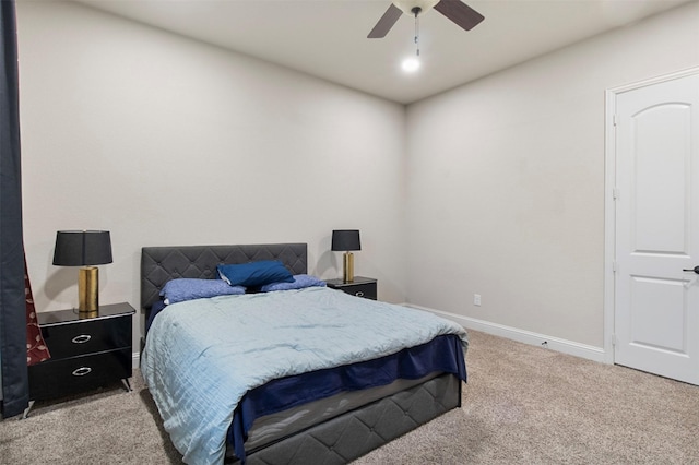 bedroom with light colored carpet and ceiling fan