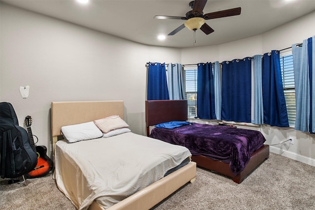 bedroom with light carpet and ceiling fan