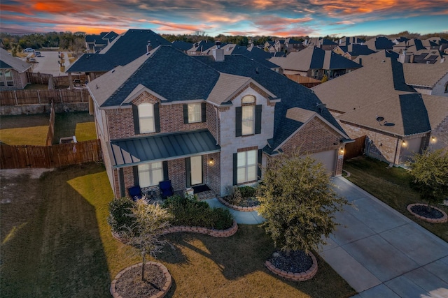 view of front of home featuring a yard and a garage