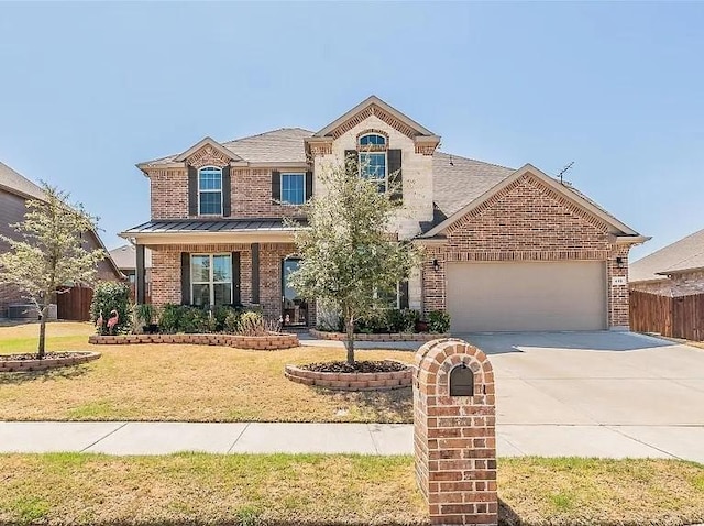 front of property featuring a garage and a front yard