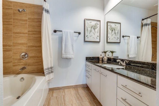 bathroom with shower / tub combo, tile patterned floors, and vanity