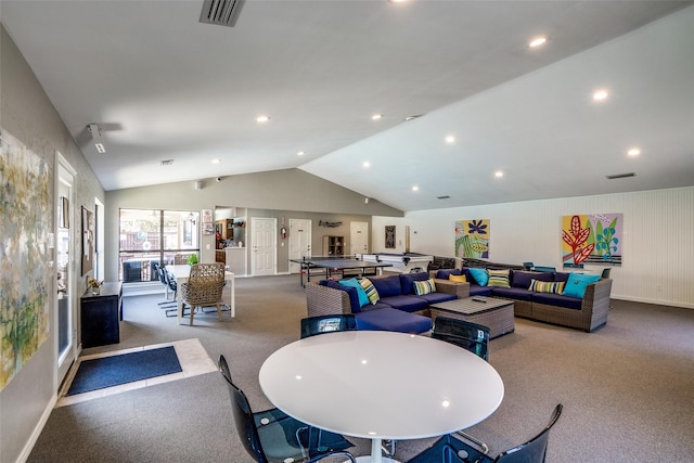 interior space featuring light colored carpet and lofted ceiling