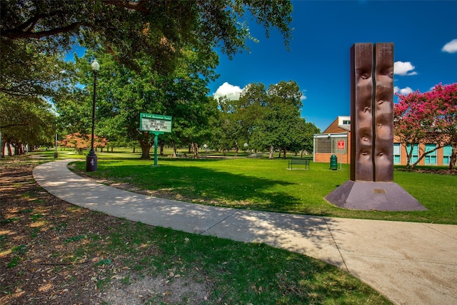 view of property's community with a yard