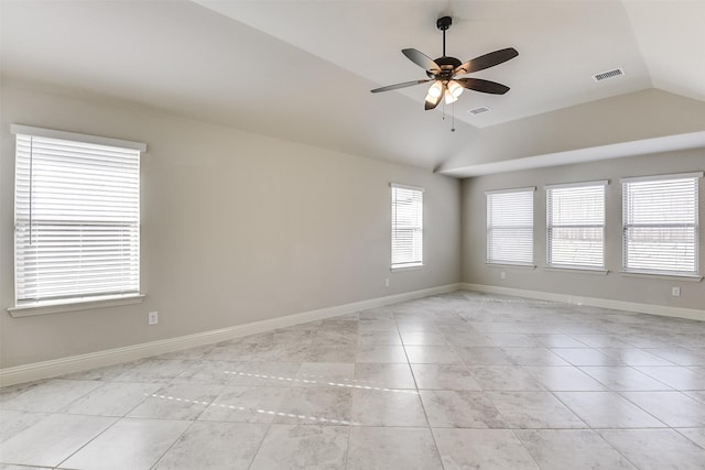 unfurnished room featuring ceiling fan, light tile patterned floors, and lofted ceiling