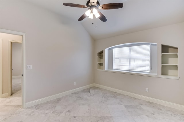 spare room featuring vaulted ceiling, ceiling fan, and built in shelves