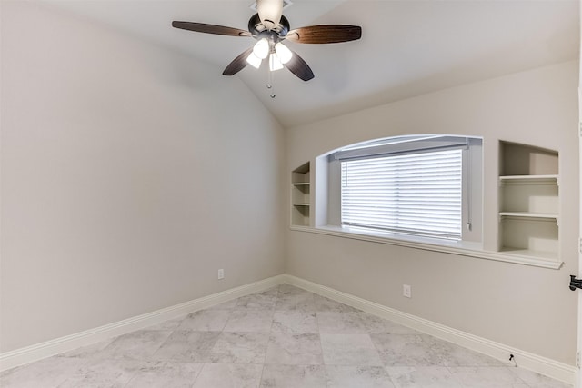 spare room featuring lofted ceiling, ceiling fan, and built in features