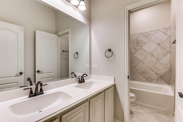 full bathroom featuring toilet, vanity, and tiled shower / bath combo