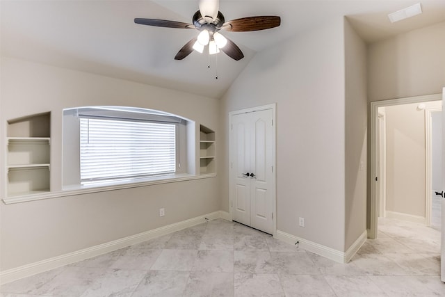 unfurnished bedroom with ceiling fan and lofted ceiling