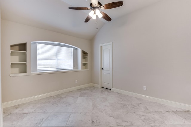 spare room featuring ceiling fan, vaulted ceiling, and built in features