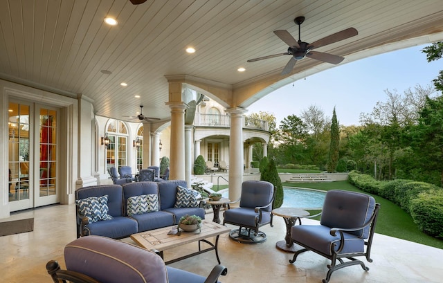 view of patio / terrace with ceiling fan, an outdoor hangout area, french doors, and a balcony