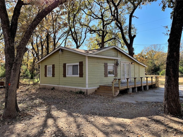 view of front of property featuring a wooden deck