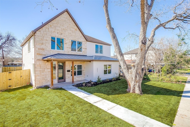 view of front of property featuring covered porch and a front lawn