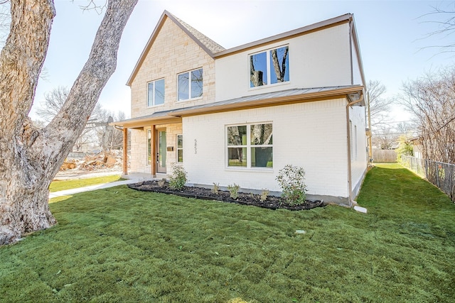 view of front of home with a front lawn