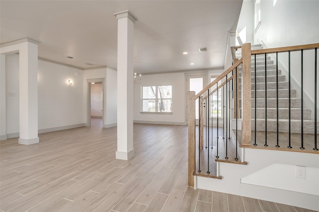 interior space with hardwood / wood-style floors, ornamental molding, and a chandelier