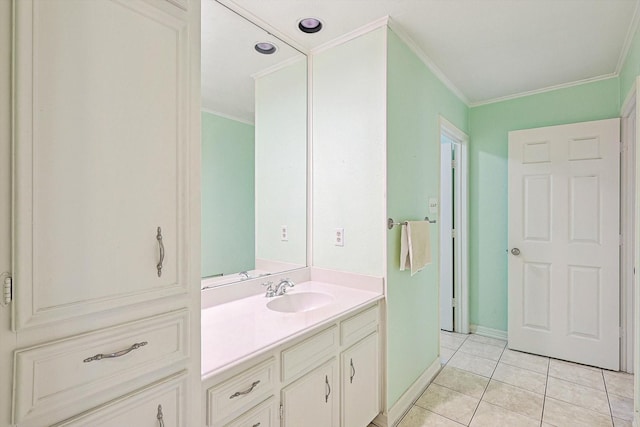 bathroom with tile patterned floors, vanity, and ornamental molding