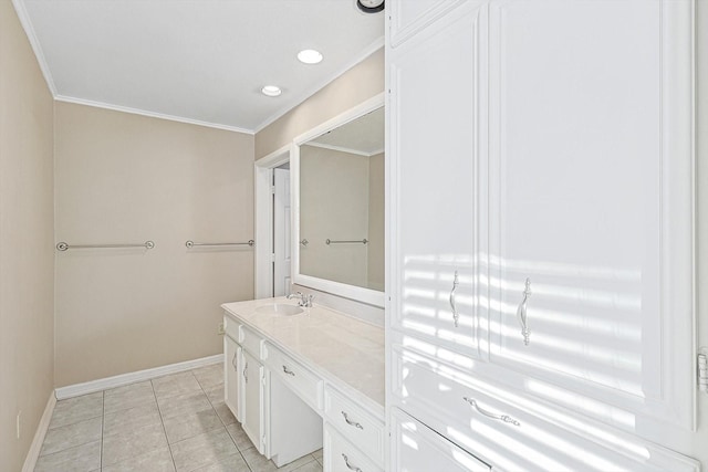 bathroom featuring vanity, crown molding, and tile patterned flooring