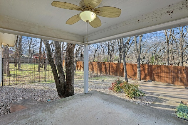 view of yard with ceiling fan and a patio area