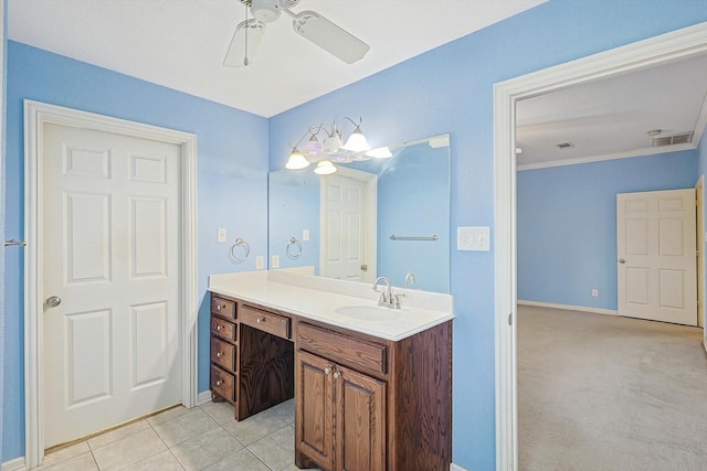 bathroom with ceiling fan, vanity, tile patterned flooring, and ornamental molding