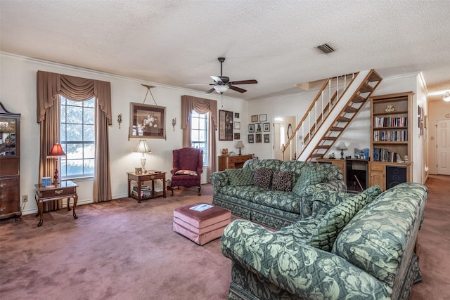 living room featuring carpet, a wealth of natural light, and a textured ceiling